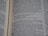 Open book displaying a passage from the Bible with a focus on the text centered on the page. The text is in black font on white paper, with some underlined words indicating emphasis.