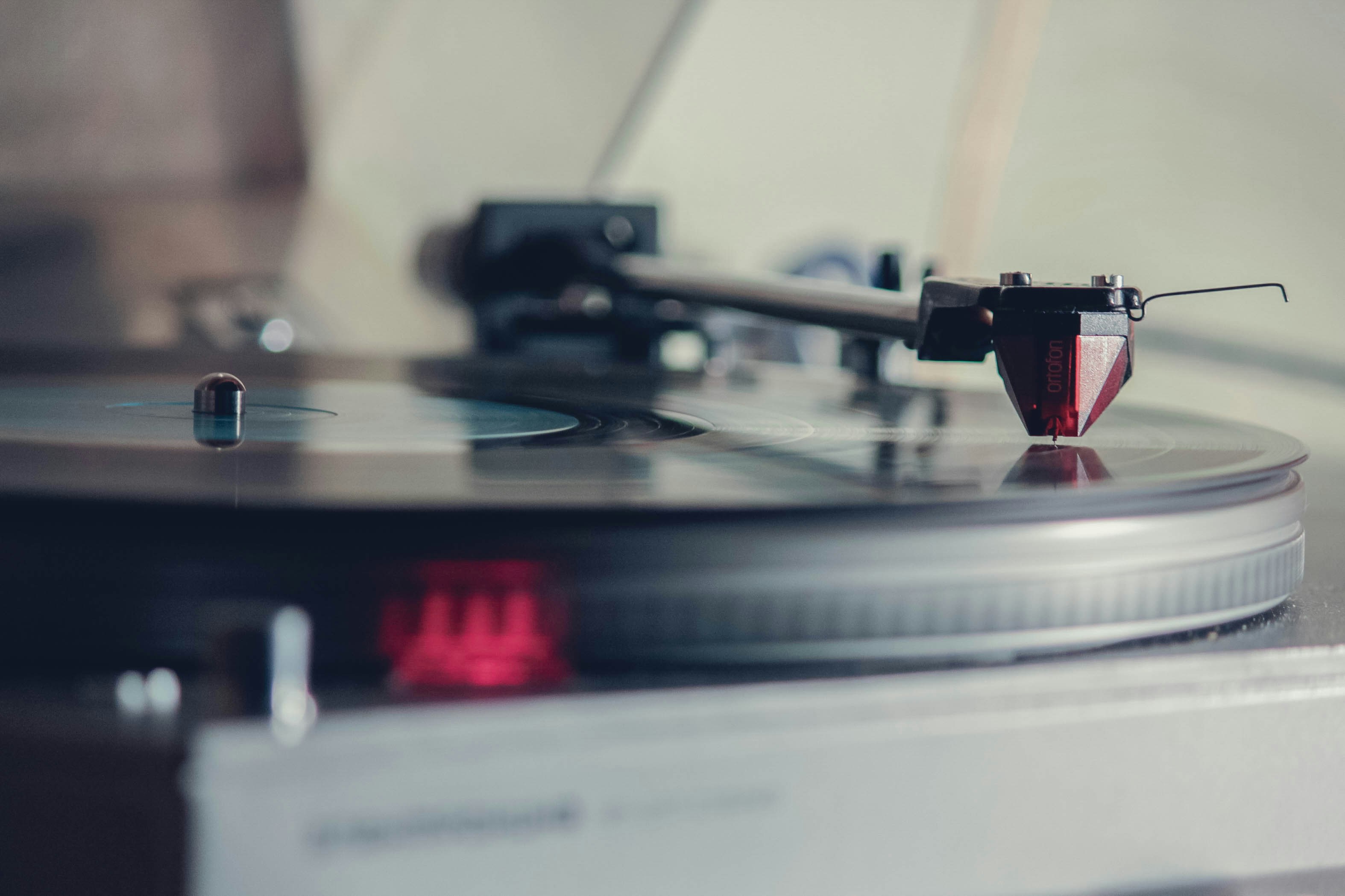 a turntable with a red light on top of it