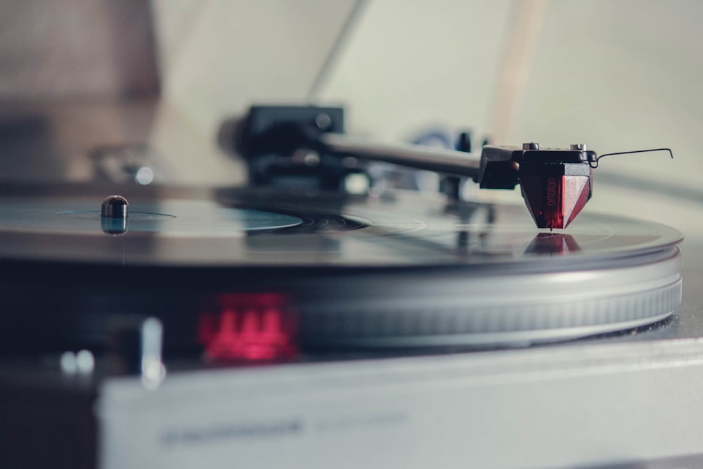 a turntable with a red light on top of it