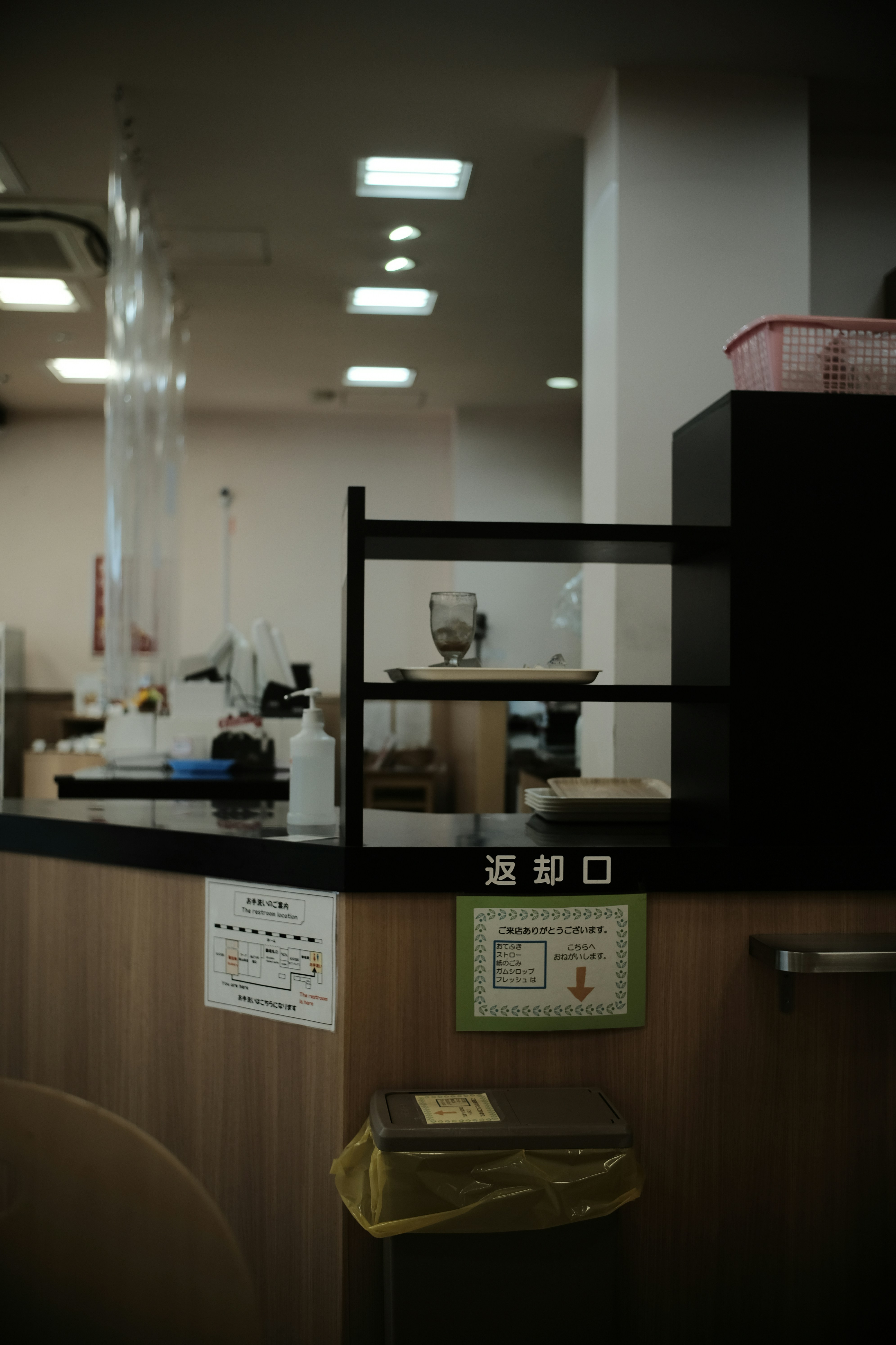 a restaurant counter with a menu on it
