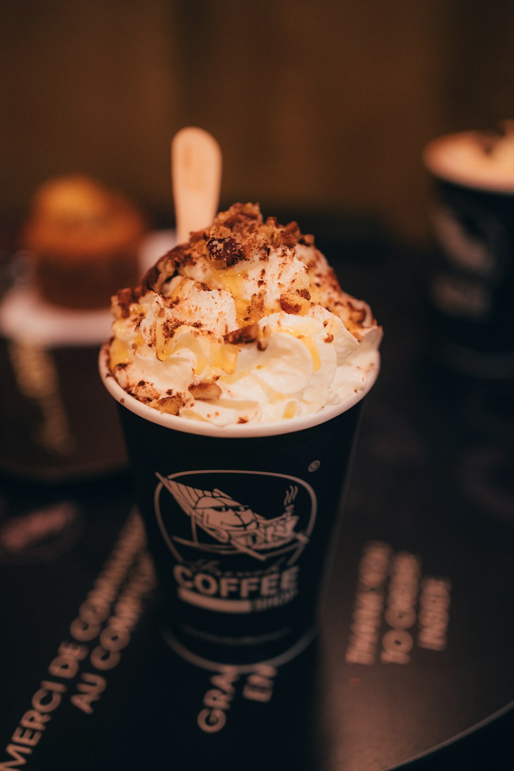 a cup of coffee with whipped cream and toppings