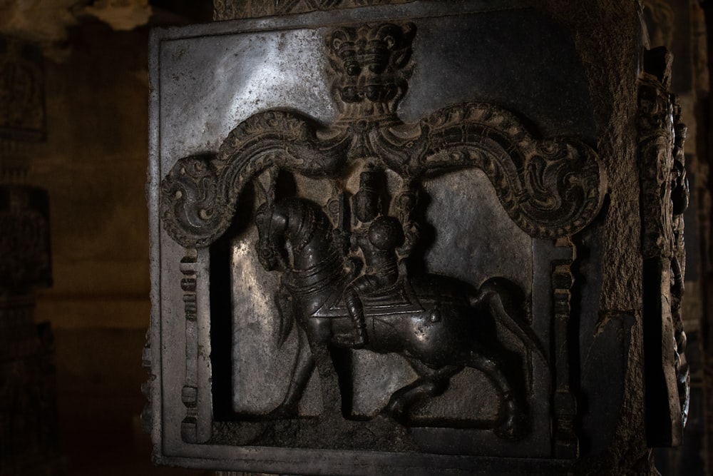 a statue of a man riding a horse