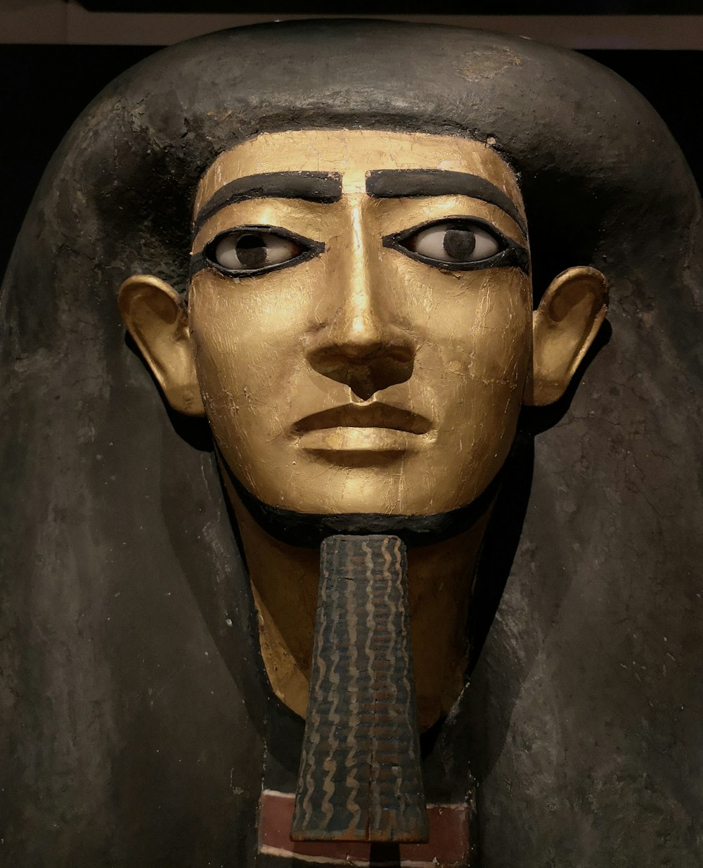 a close up of a statue of an egyptian pharaoh