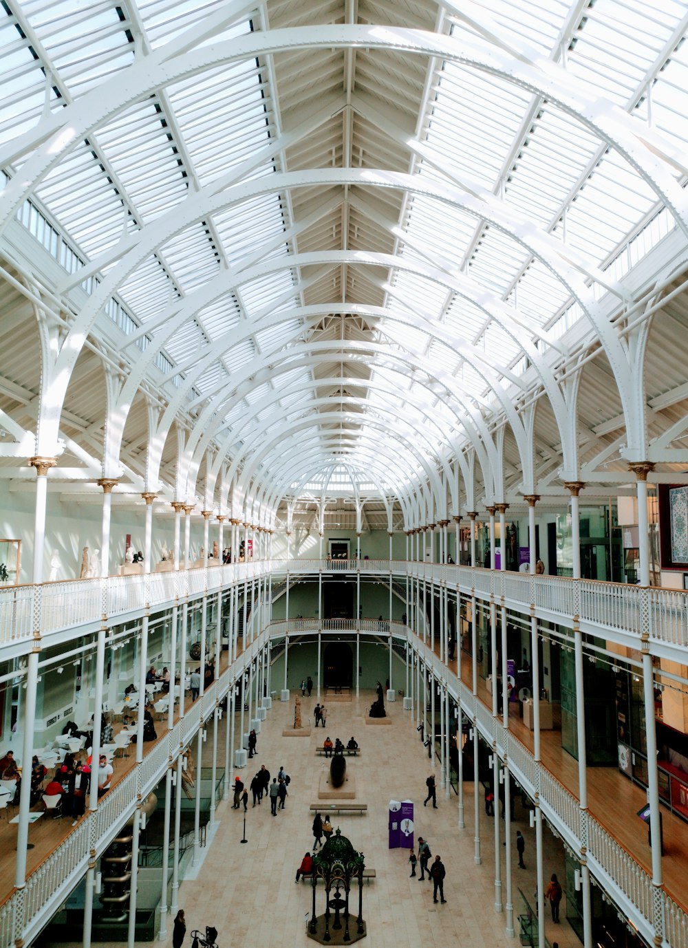 a view of a large building with people walking around