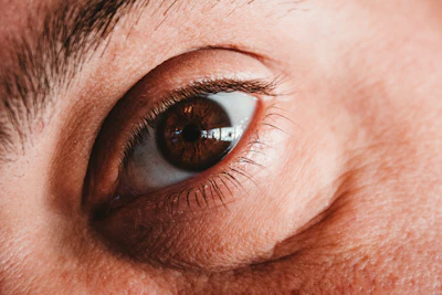 a close up of a person's brown eye