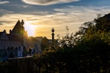 Sunset view over a famous cityscape with tourists admiring the scene.