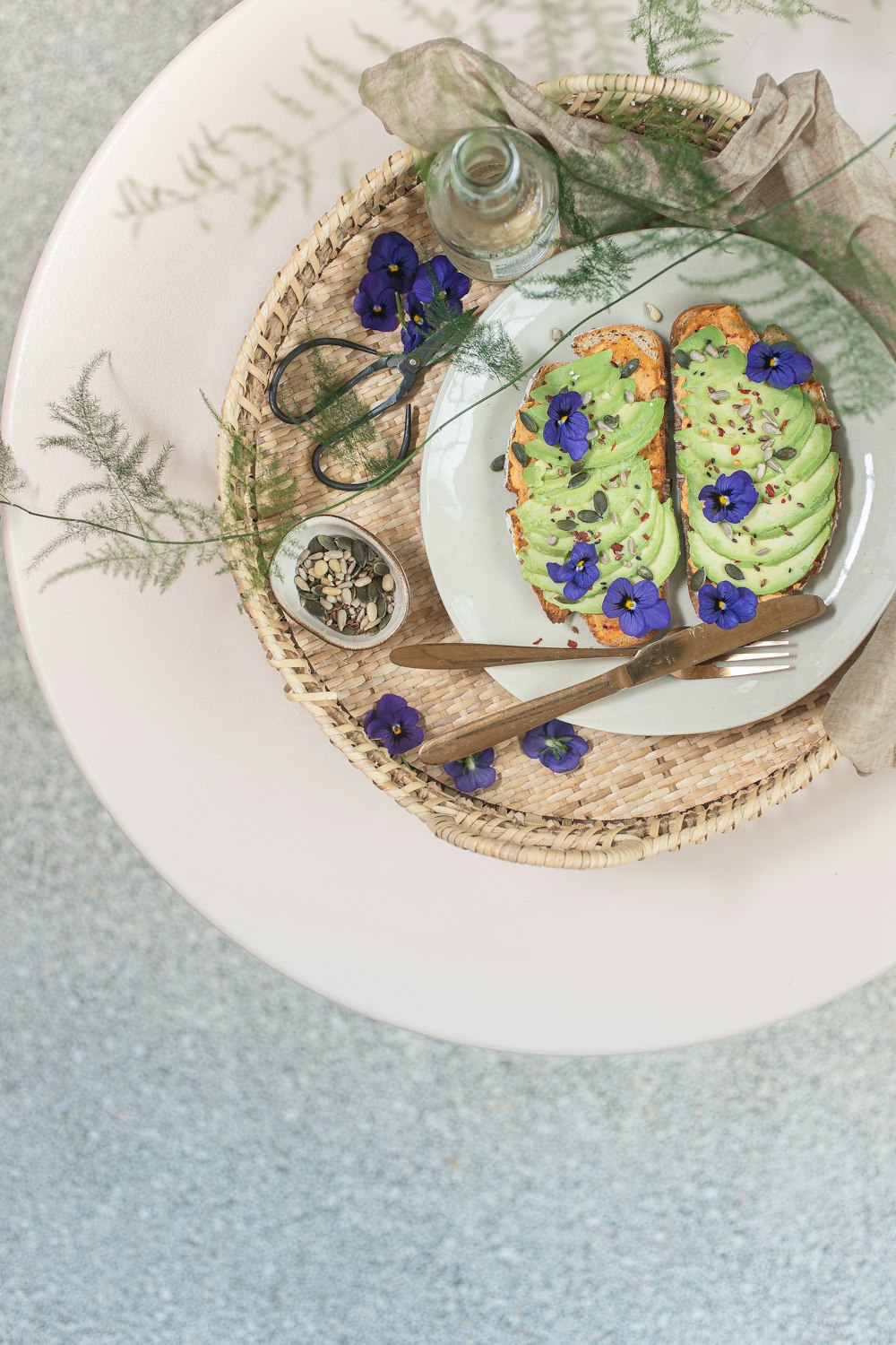 a white plate topped with two pastries on top of a table