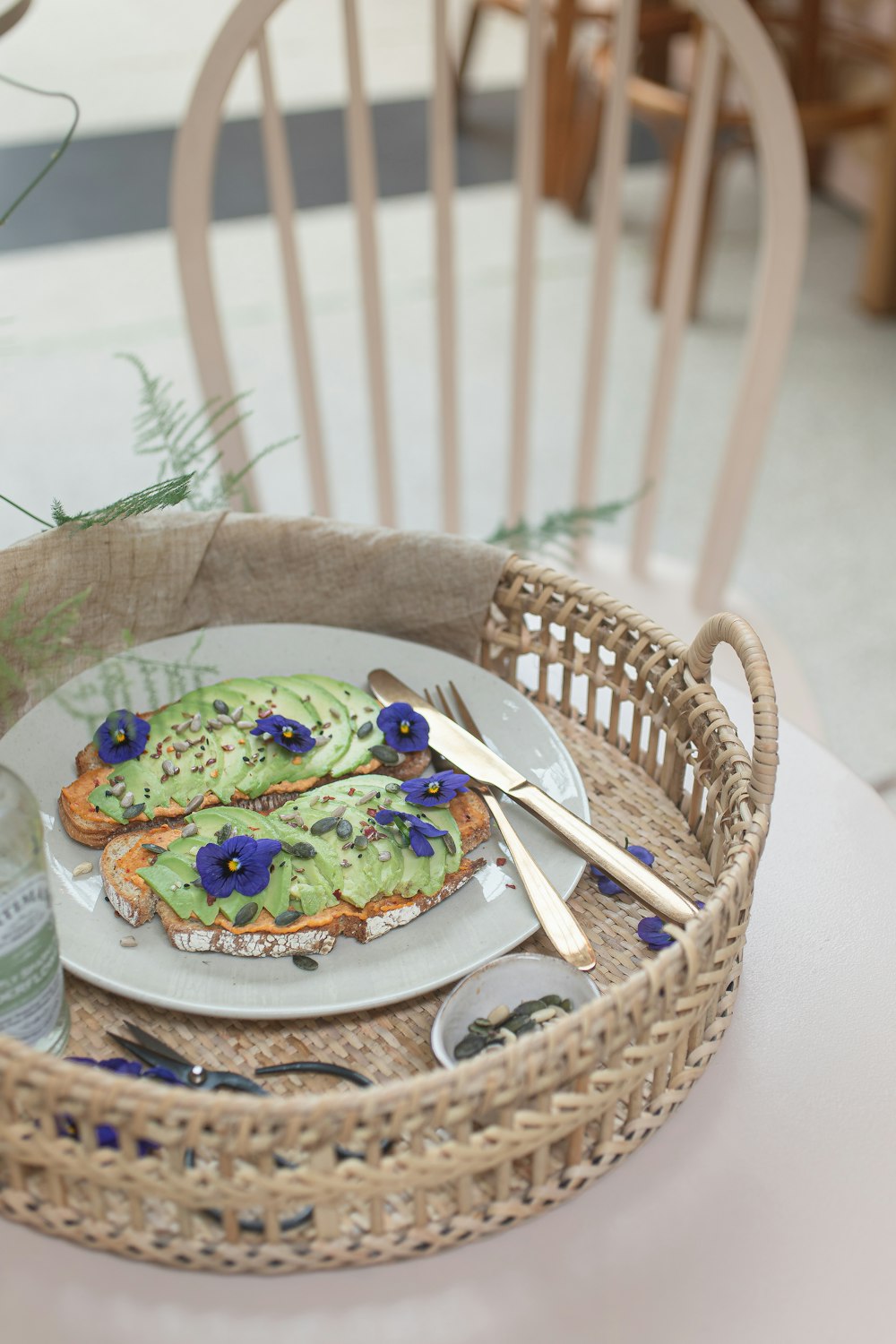 a plate of food on a wicker basket on a table