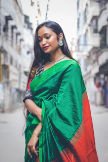 a woman in a green and red sari