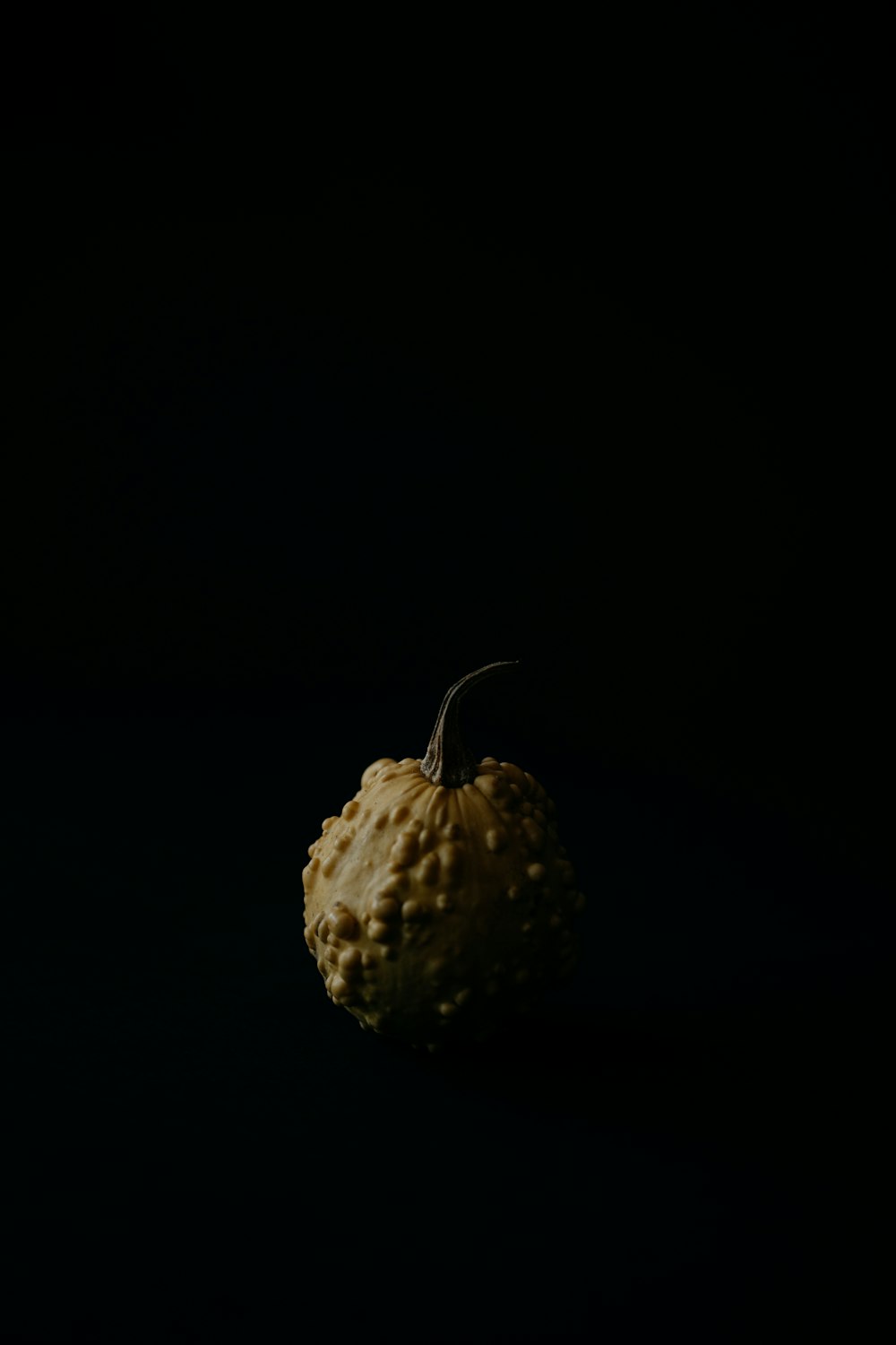 a close up of a fruit on a black background