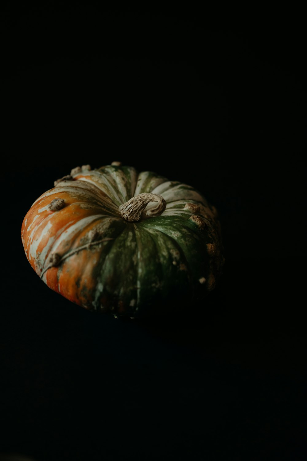 a small pumpkin sitting on top of a table