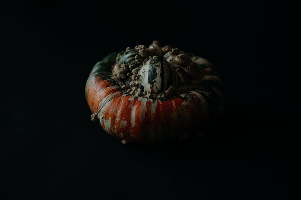 a close up of a pumpkin on a black background