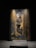 A striking artwork featuring a figure with an abstract form, surrounded by rich, colorful brushstrokes depicting a natural scene with water, lilies, and vertical elements like reeds or bamboo. The composition is set against a dark background, highlighting the vividness of the painting.