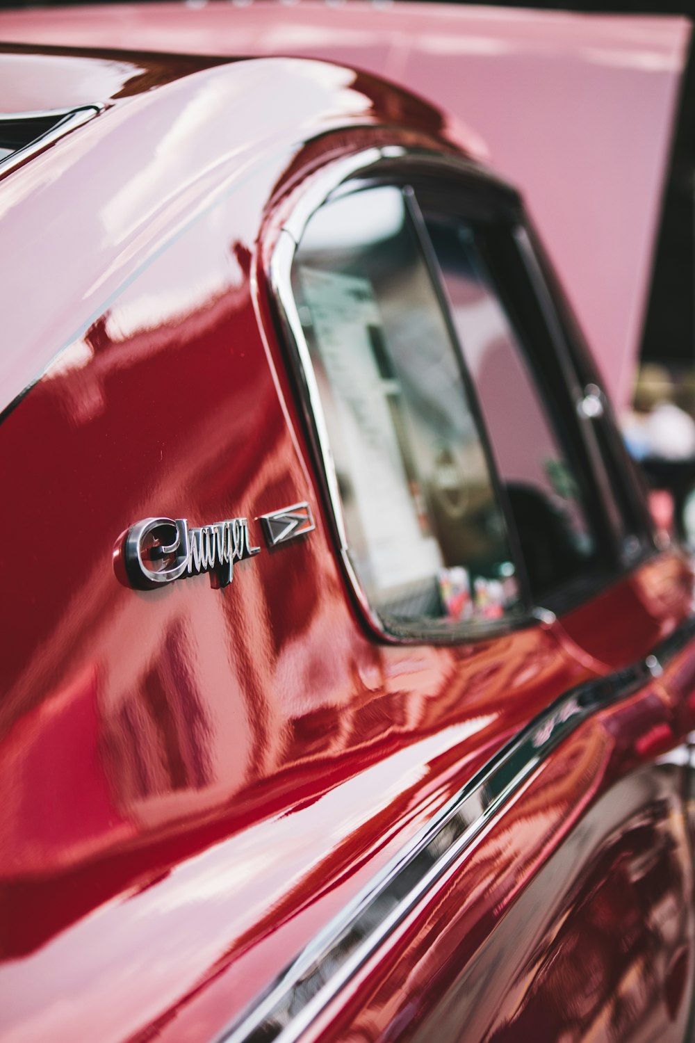 a close up of the emblem on a red car