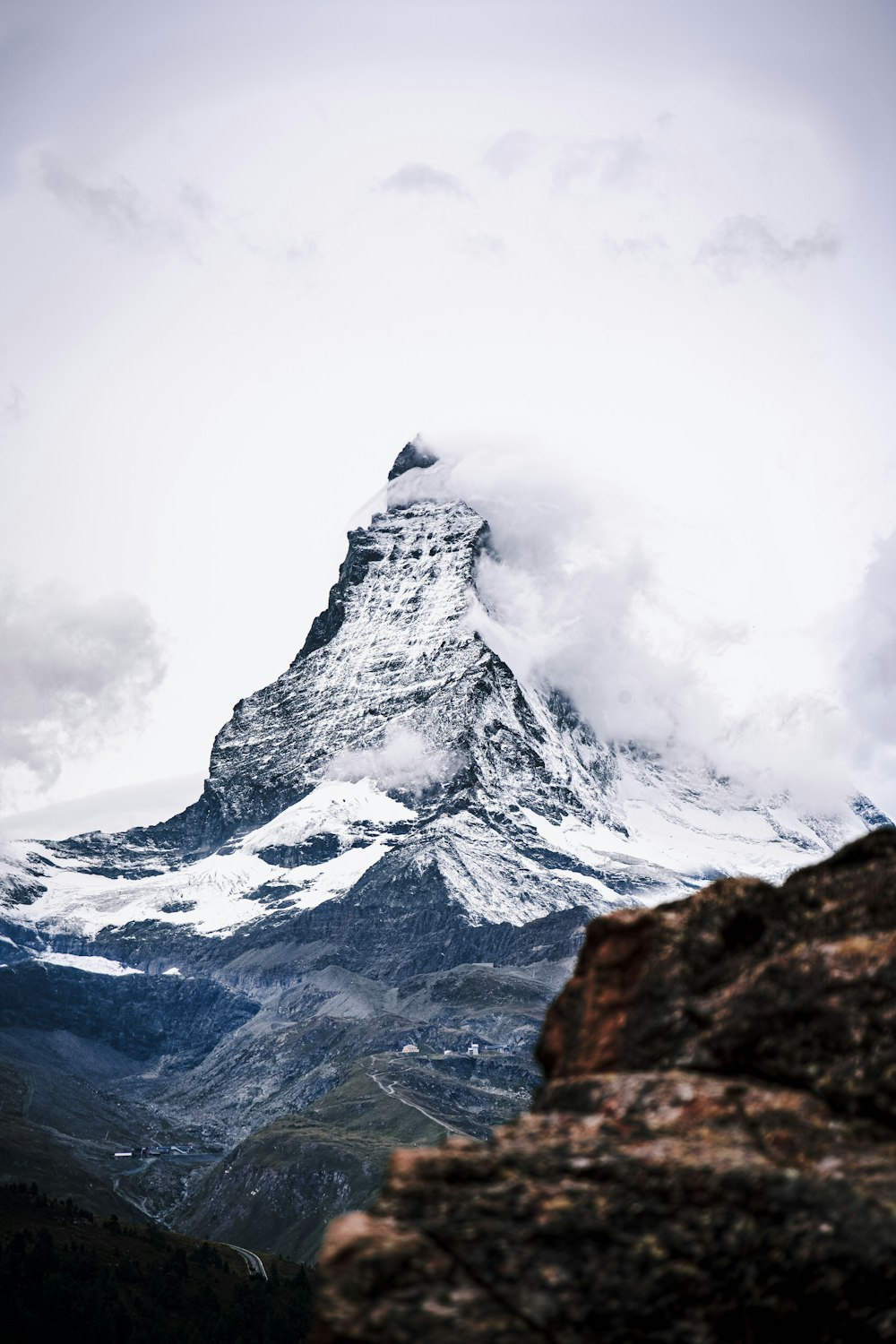 a very tall mountain with a very tall peak