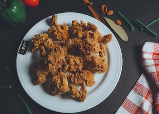 a plate of fried chicken on a table