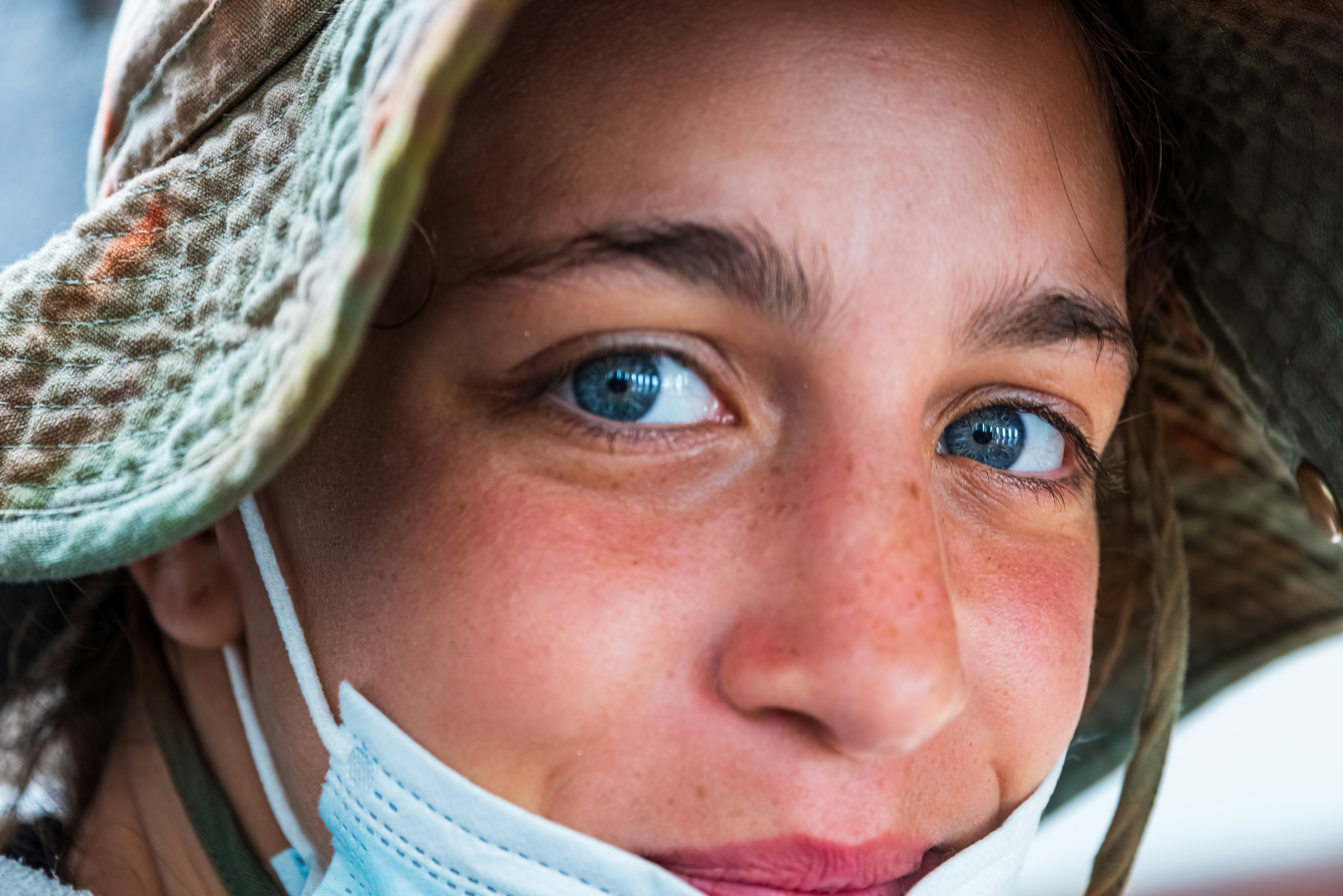 a close up of a person wearing a hat