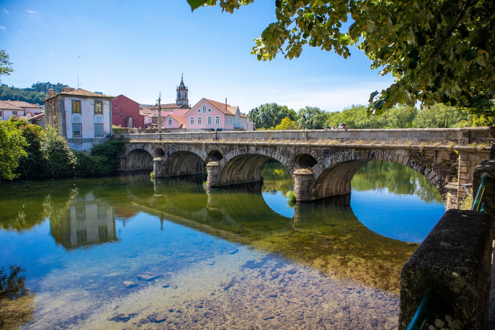 a bridge over a river in a small town