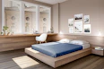 a bed room with a neatly made bed and a desk
