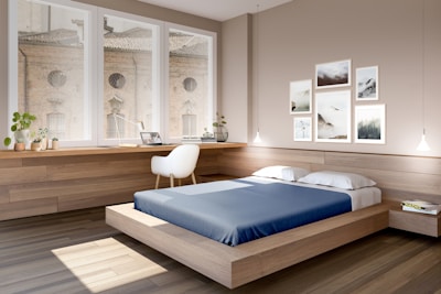Modern platform bed with sleek wooden frame and vibrant blue bedding in a minimalist room.