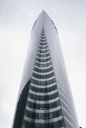 a very tall building with a sky background