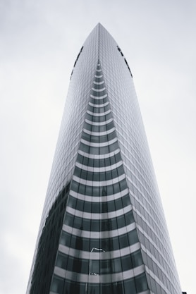 a very tall building with a sky background