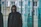 Man wearing a sleek black hoodie with subtle golden accents inspired by the 2026 World Cup, standing in a modern urban setting.