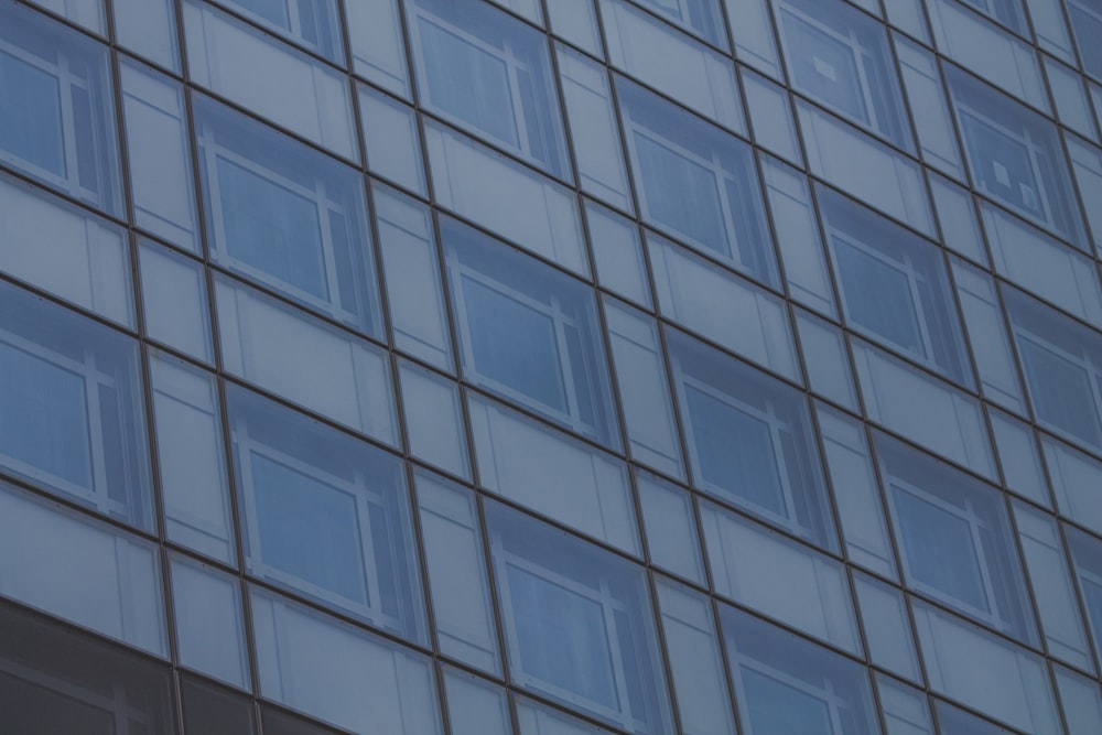 a building with many windows and a clock on the side of it