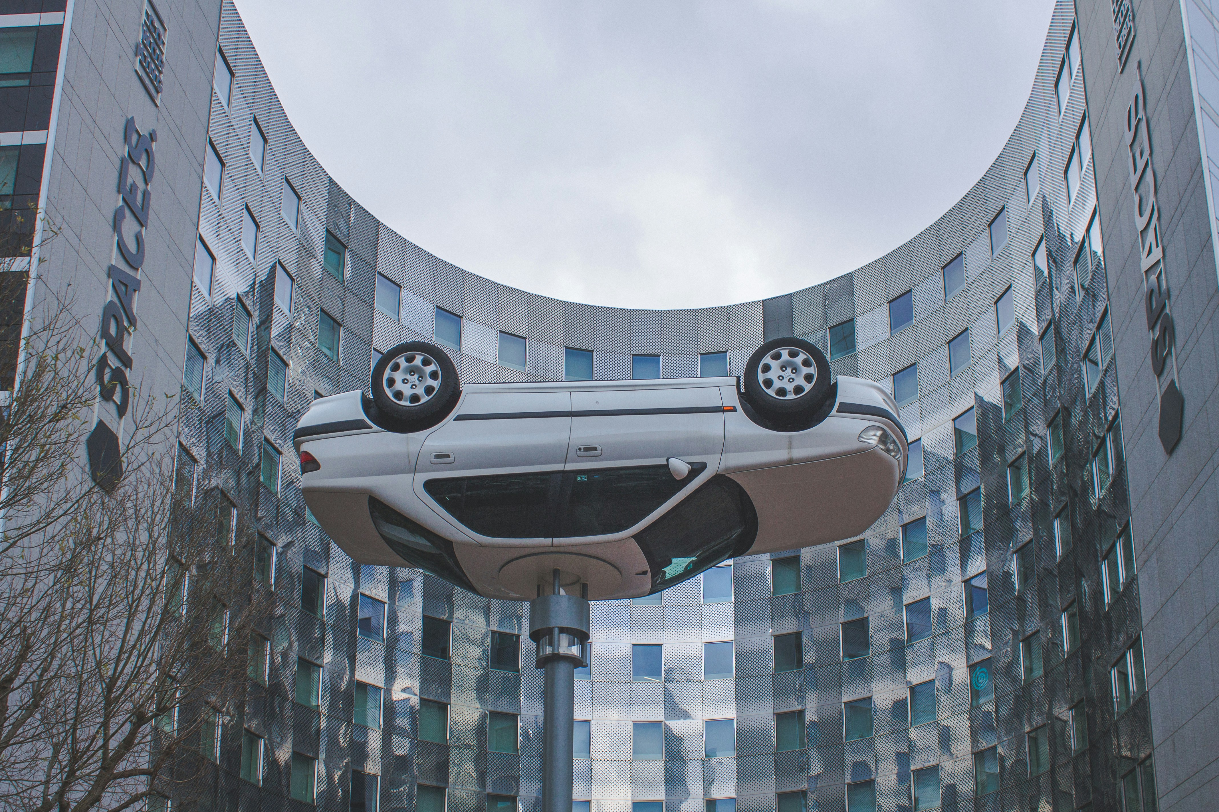 a futuristic car is in front of a building