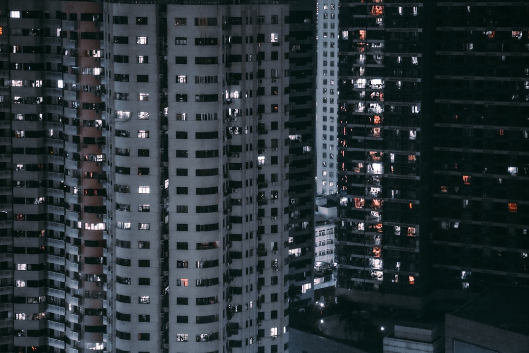 a group of tall buildings in a city at night,