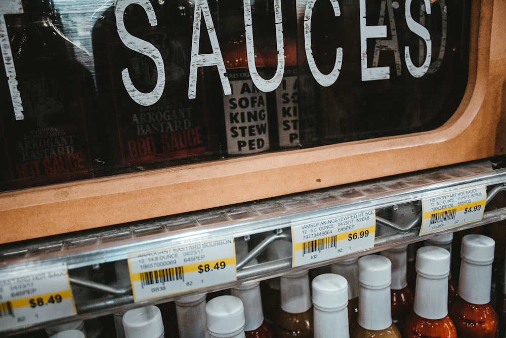 a store shelf with sauces on it