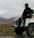 a man sitting on top of a white truck