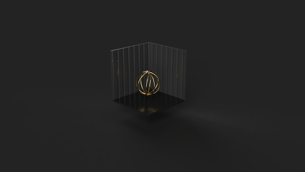 a black box with a gold ring on it