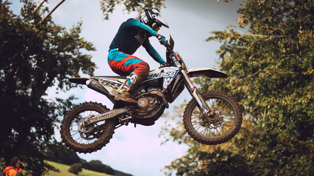 a person on a dirt bike jumping in the air