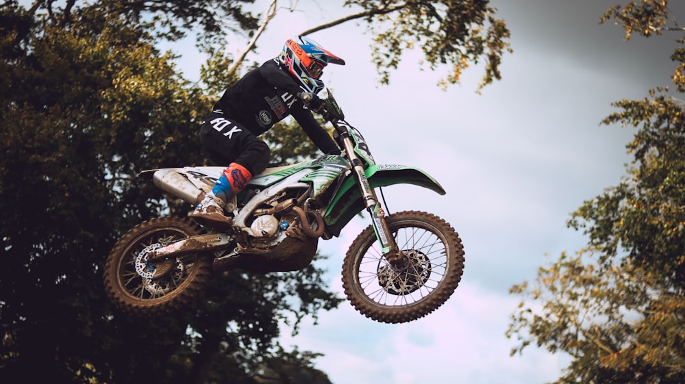 a person on a dirt bike in the air