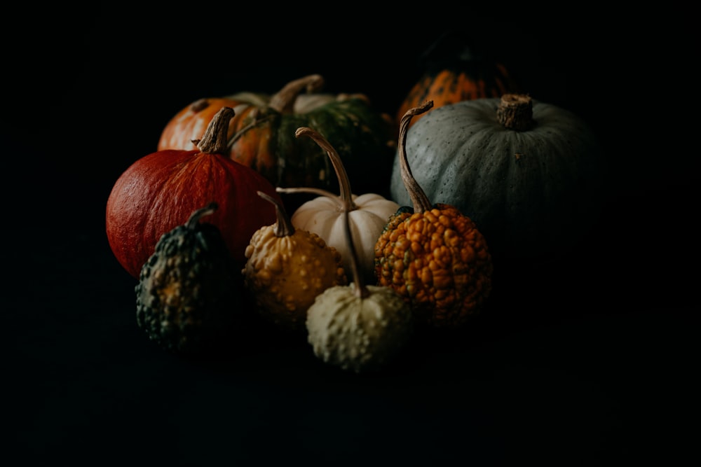 a group of pumpkins sitting on top of a table