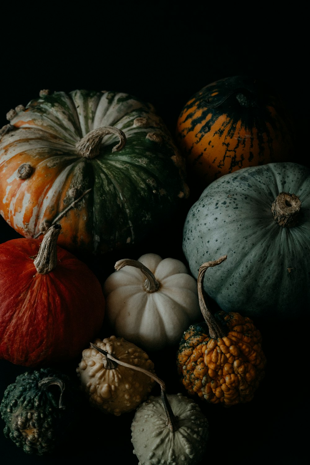 a group of pumpkins sitting on top of a table