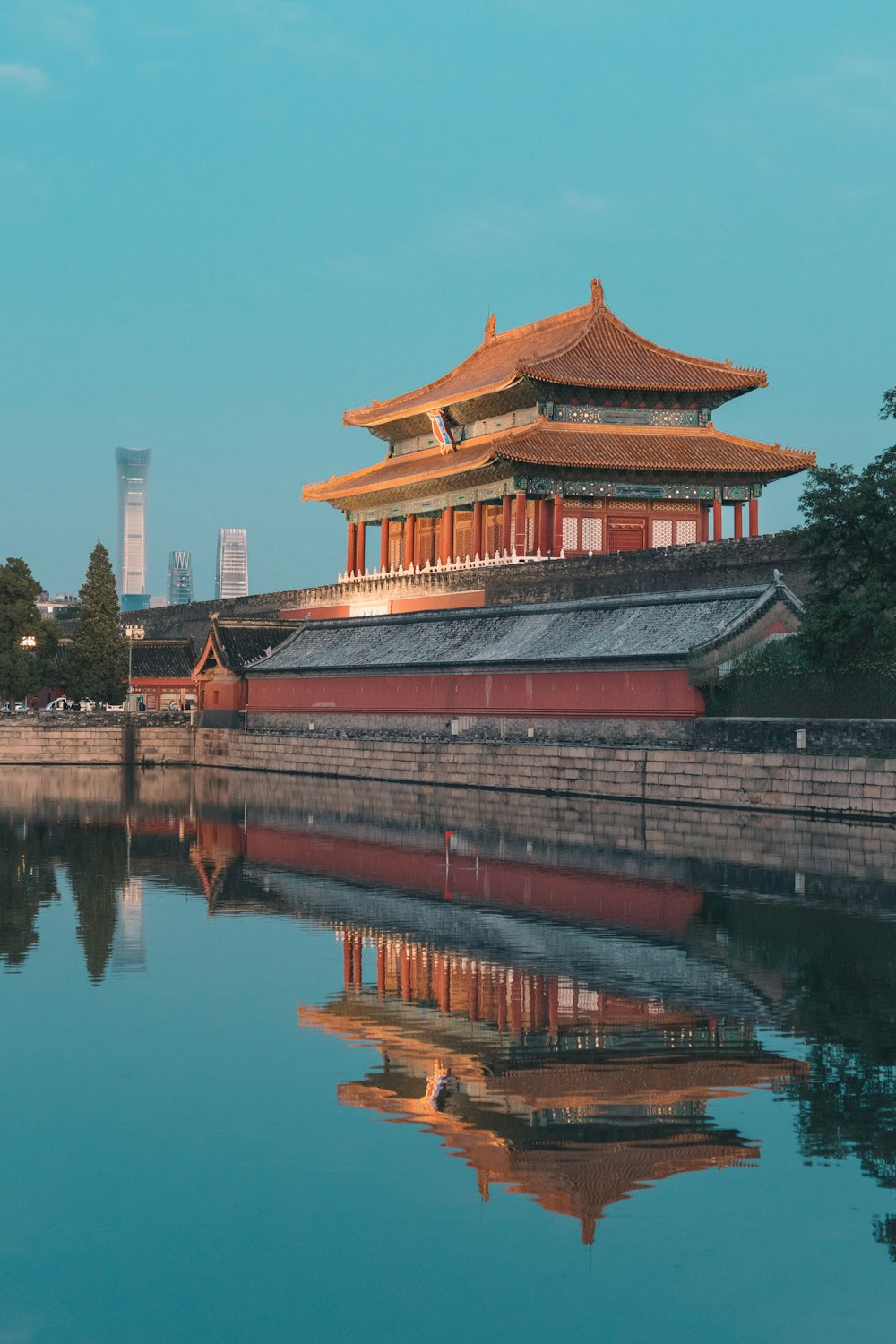 a large building sitting next to a body of water