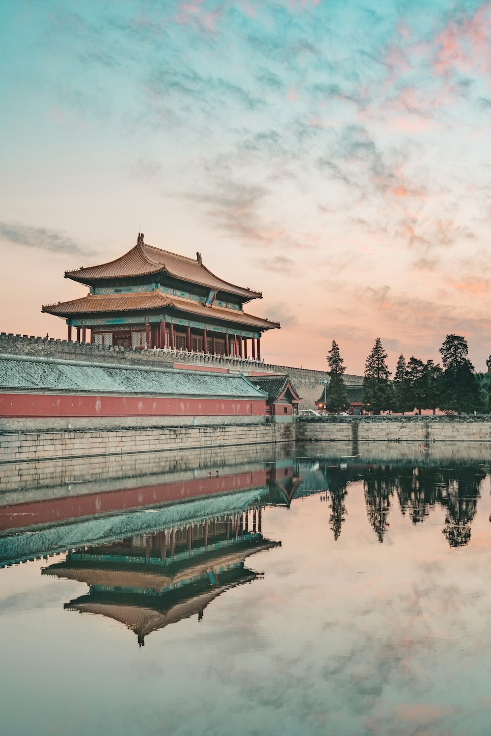 a large building sitting next to a body of water