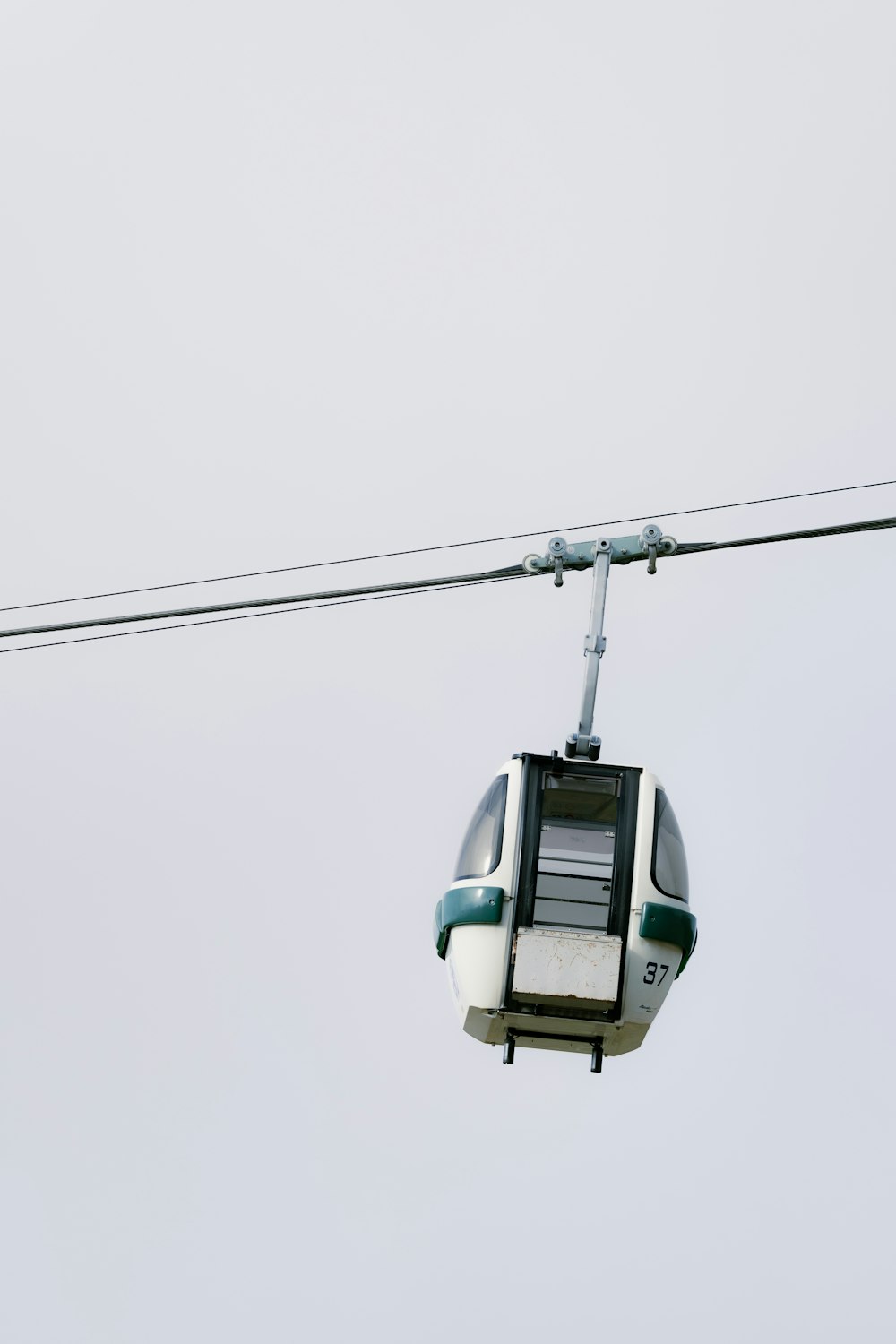 a cable car with a seat on the top of it
