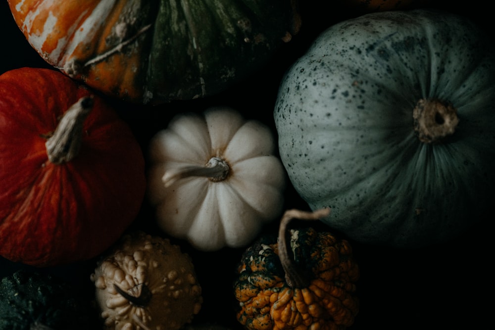 a group of pumpkins sitting next to each other