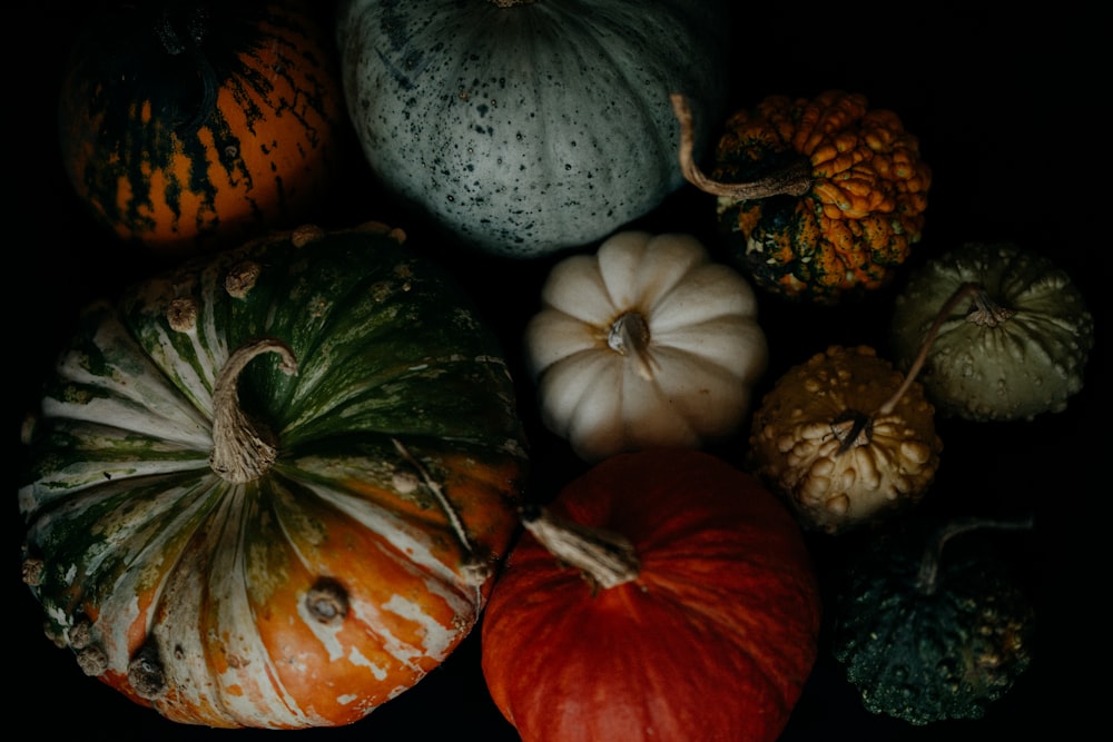 a group of pumpkins sitting on top of a table