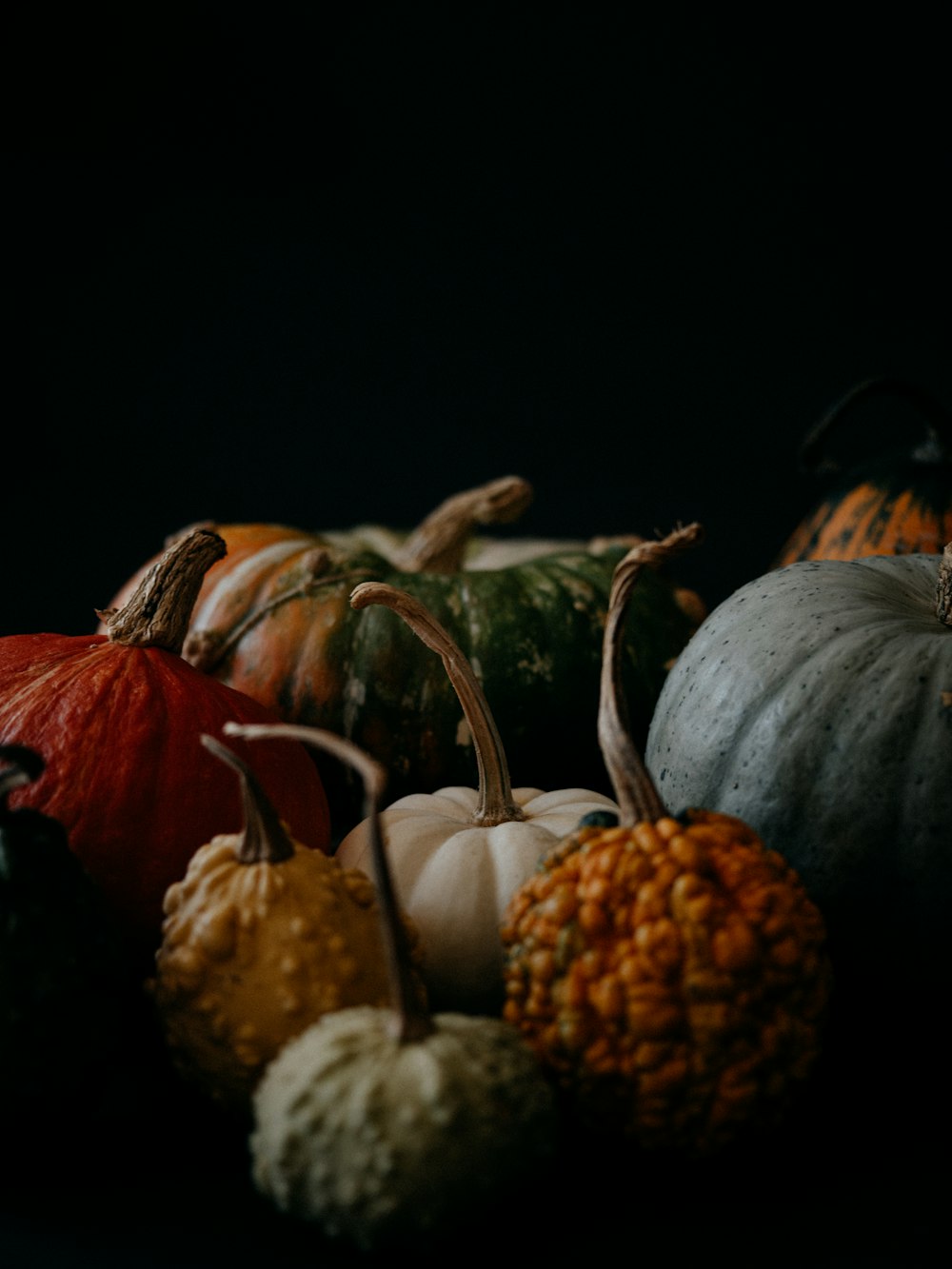 a group of pumpkins sitting on top of a table