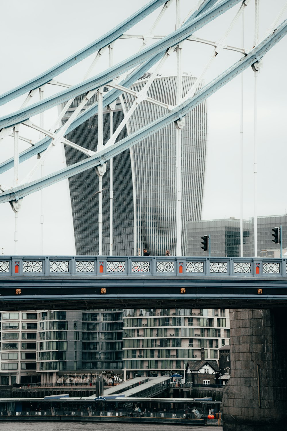 a view of a bridge with a building in the background