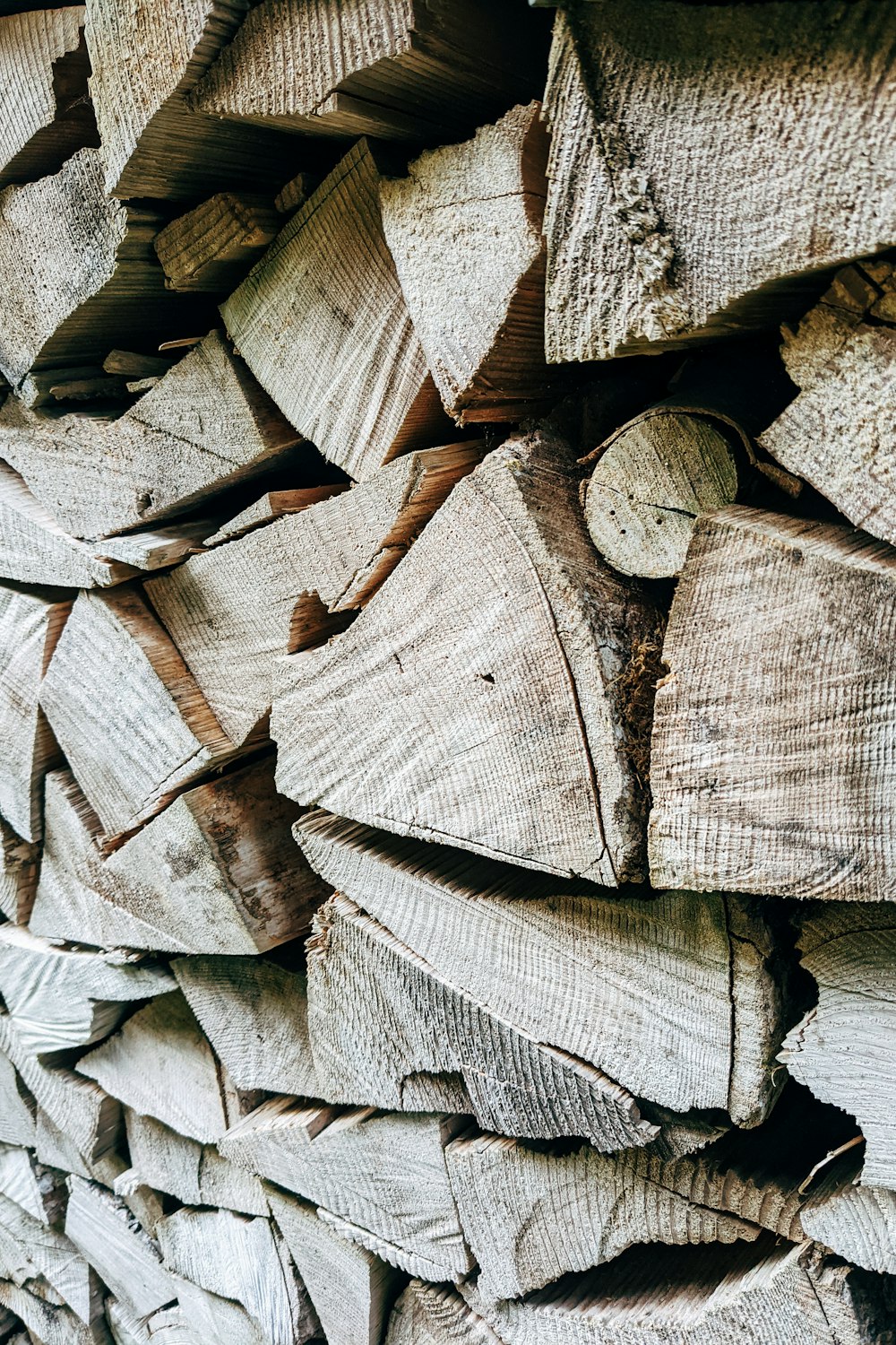 a close up of a pile of wood logs