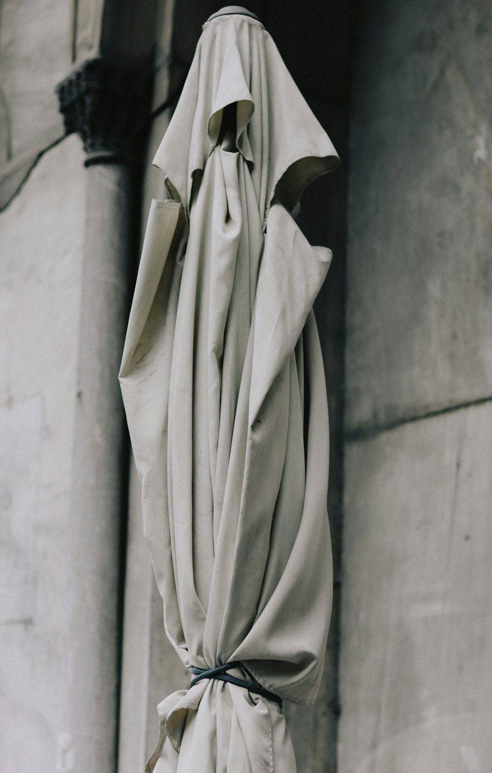 a white cloth draped over the top of a building