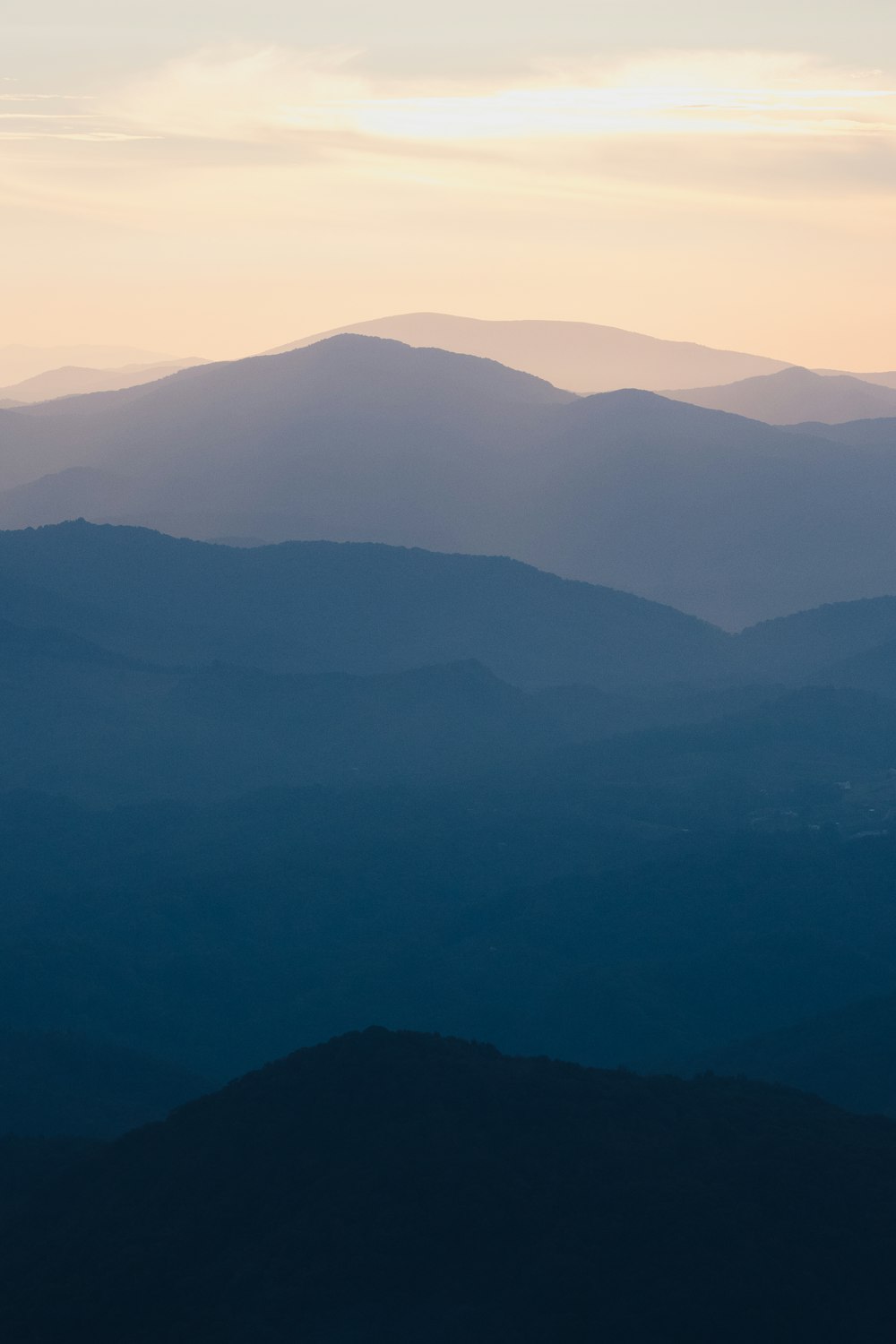 a view of a mountain range at sunset