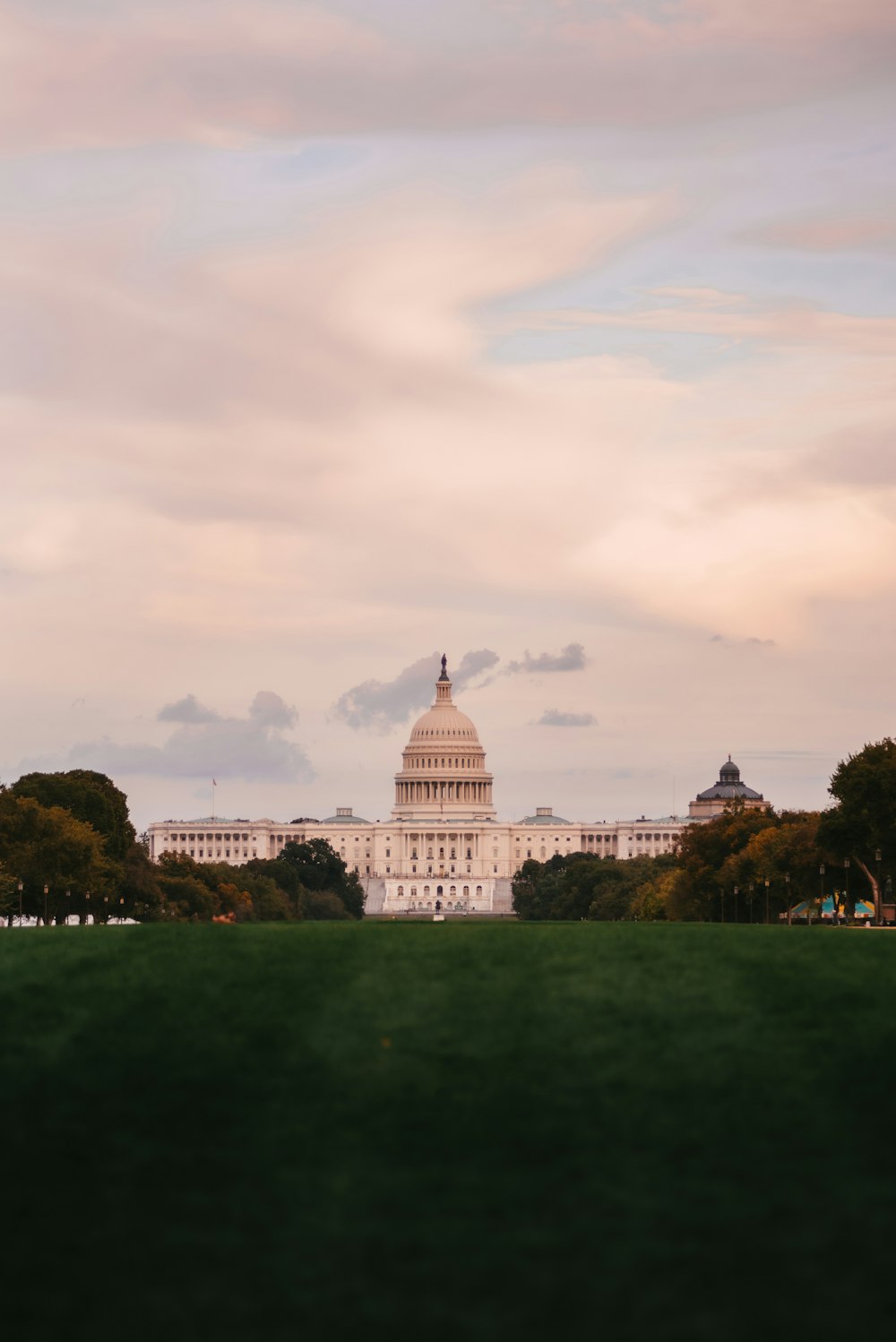 a view of the capitol building from across the lawn