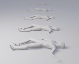 a group of white plastic figures laying on top of each other