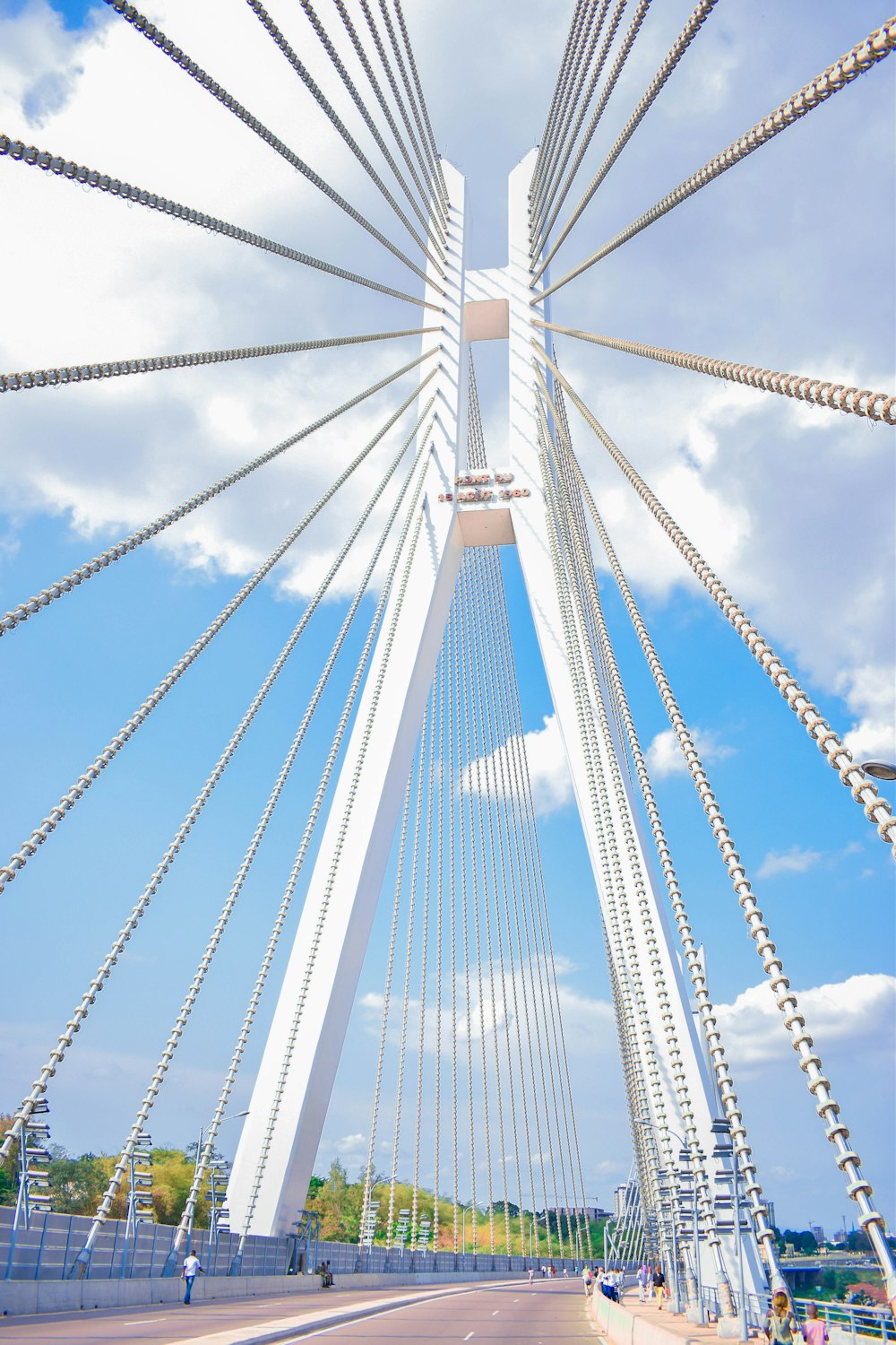 a view of a very tall bridge from the ground